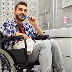 Man in wheelchair brushing his teeth